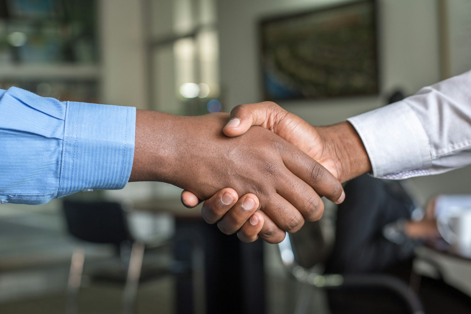 Home ElectriX Services electrician shaking hands with a customer